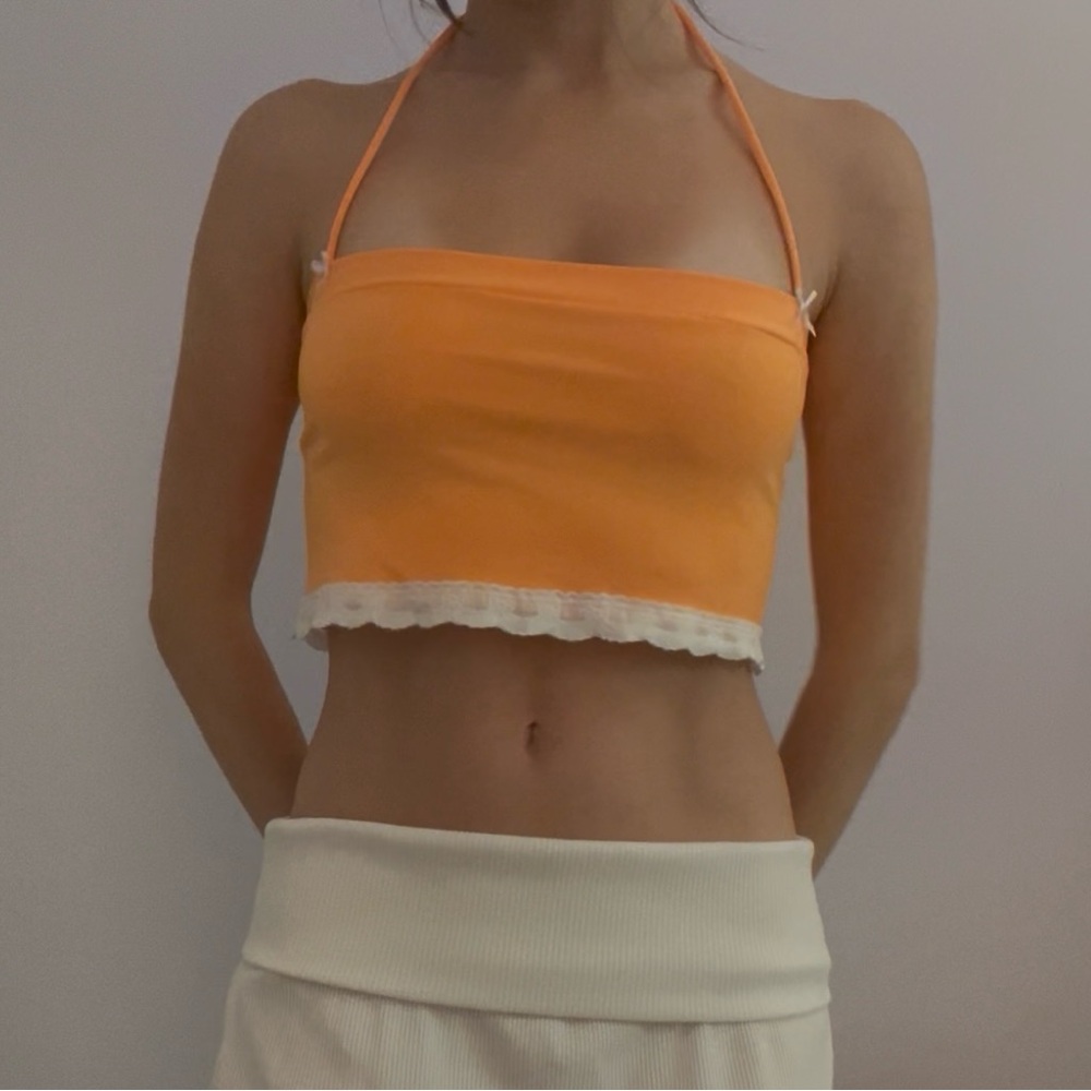 Bright orange cropped halter tube top with white lace trim and cute bows